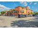 Morton's Gourmet Market, featuring colorful architecture and a well-maintained parking lot at 2105 Hibiscus St, Sarasota, FL 34239
