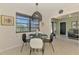 Cozy dining area with a modern glass table and stylish lighting fixture at 2105 Hibiscus St, Sarasota, FL 34239