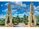 The grand entrance to Sarasota Bayfront is marked by an architectural arch, beautiful landscaping, and palm trees at 2105 Hibiscus St, Sarasota, FL 34239