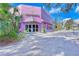 The Sarasota Film Society building featuring a bright pink facade and unique architectural elements at 2105 Hibiscus St, Sarasota, FL 34239