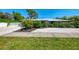 Lovely home showcasing manicured landscaping and a white shell driveway at 2105 Hibiscus St, Sarasota, FL 34239