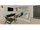 Comfortable living space with modern decor, a gray leather sofa, and natural light at 2105 Hibiscus St, Sarasota, FL 34239