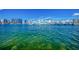 Scenic waterfront view showcasing vibrant blue water, a bustling marina, and the city skyline on a clear day at 2105 Hibiscus St, Sarasota, FL 34239