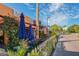 Knick's Tavern features cozy outdoor seating with blue umbrellas and charming street view at 2105 Hibiscus St, Sarasota, FL 34239