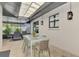 Enjoy this patio featuring a large dining table and chairs with an outdoor lounging area at 2105 Hibiscus St, Sarasota, FL 34239
