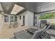 Spacious screened patio with dining area, barbecue, and outdoor lounge seating at 2105 Hibiscus St, Sarasota, FL 34239
