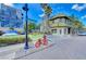 Charming street view featuring unique architecture, lush landscaping, and a decorative red bicycle at 2105 Hibiscus St, Sarasota, FL 34239