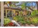Inviting front entrance with lush landscaping creating a colorful and welcoming approach to the home at 2239 Circlewood Dr # 17, Sarasota, FL 34231