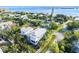 Beautiful aerial view of a two-story home with lush green landscaping located near a body of water at 2300 Avenue B, Bradenton Beach, FL 34217