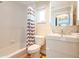 Cozy bathroom features a shower-tub combo and modern fixtures at 2300 Avenue B, Bradenton Beach, FL 34217