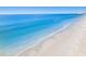 Picturesque aerial view of a stunning beach with clear turquoise waters and soft white sand at 2300 Avenue B, Bradenton Beach, FL 34217