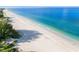 Expansive aerial view of a beautiful beach with calm waters, perfect for relaxation and recreation at 2300 Avenue B, Bradenton Beach, FL 34217
