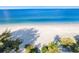 Breathtaking aerial view of a pristine white sandy beach and crystal-clear turquoise water at 2300 Avenue B, Bradenton Beach, FL 34217