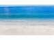 Calm beach waters meet the sands in this beautiful aerial perspective at 2300 Avenue B, Bradenton Beach, FL 34217