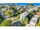Beautiful two-story house with a manicured lawn near beach and a brick paver driveway at 2300 Avenue B, Bradenton Beach, FL 34217