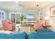 Bright living room with beachy decor and hardwood floors, creates a relaxing atmosphere at 2300 Avenue B, Bradenton Beach, FL 34217