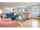 Bright living area with hardwood floors, coastal décor and view into the dining area at 2300 Avenue B, Bradenton Beach, FL 34217