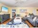 Bright living room offers a comfortable seating arrangement and access to the bedroom at 2300 Avenue B, Bradenton Beach, FL 34217