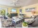 Comfortable living room with plush seating, vibrant decor, and access to the outdoor balcony at 2300 Avenue B, Bradenton Beach, FL 34217