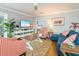 Cozy living room with a coastal style, comfortable seating and hardwood floors at 2300 Avenue B, Bradenton Beach, FL 34217