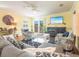 Inviting living room boasts stylish furnishings, a TV, and seamless access to the balcony at 2300 Avenue B, Bradenton Beach, FL 34217