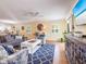 Spacious living area featuring ample seating, a TV, and an open floor plan at 2300 Avenue B, Bradenton Beach, FL 34217