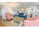 Open-concept living space with view to the dining room, coastal décor and hardwood floors at 2300 Avenue B, Bradenton Beach, FL 34217