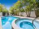 Beautiful pool and spa area with lush tropical landscaping providing a private outdoor oasis at 2300 Avenue B, Bradenton Beach, FL 34217