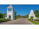 Community entrance with a clock tower and landscaping in the Windward community at 2616 Star Apple Way, Sarasota, FL 34240
