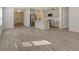 Bright, open floorplan features a modern kitchen and an adjacent living area at 2616 Star Apple Way, Sarasota, FL 34240