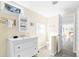 Bright bathroom leads to living area and features tile flooring, toilet, and shower at 2830 Gypsy St, Sarasota, FL 34231