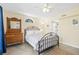 Comfortable bedroom with neutral walls, a ceiling fan, and natural light at 2830 Gypsy St, Sarasota, FL 34231