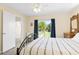 Comfortable bedroom with neutral decor, natural light, and backyard access at 2830 Gypsy St, Sarasota, FL 34231