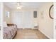 Bright bedroom features tile flooring, daybed, two closets, and ceiling fan at 2830 Gypsy St, Sarasota, FL 34231