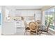 Bright eat-in kitchen boasts white cabinetry and lots of natural light at 2830 Gypsy St, Sarasota, FL 34231