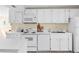 Well-maintained kitchen with white appliances and plenty of counter space at 2830 Gypsy St, Sarasota, FL 34231