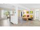Open-concept living area showcasing tile floors, bright interiors, and a living and dining space at 2830 Gypsy St, Sarasota, FL 34231