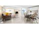Sunlit living area adjacent to a modern kitchen with white cabinetry at 2830 Gypsy St, Sarasota, FL 34231