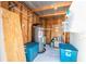 Organized shed interior providing storage for home maintenance, featuring shelves and water heater at 2830 Gypsy St, Sarasota, FL 34231