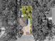 Overhead view of property displaying the layout amidst lush greenery. Includes property line at 2910 11Th W Ave, Bradenton, FL 34205