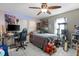 Bedroom with game chair, computer setup, neon lighting, and ceiling fan at 2910 11Th W Ave, Bradenton, FL 34205