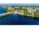 Stunning aerial view of waterfront homes, boat dock, and pristine waters, capturing the essence of waterfront living at 315 Sapphire Lake Dr # 202, Bradenton, FL 34209