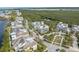 Aerial view of the community showcasing charming homes, lush landscaping, and waterfront views at 315 Sapphire Lake Dr # 202, Bradenton, FL 34209