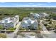 Stunning aerial view of a multi-story home with lush landscaping and a glimpse of the beautiful surroundings at 315 Sapphire Lake Dr # 202, Bradenton, FL 34209