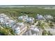 Aerial view showcasing community townhomes surrounded by lush greenery and waterways at 315 Sapphire Lake Dr # 202, Bradenton, FL 34209
