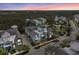 Scenic aerial view showcasing a beautifully lit home surrounded by lush landscaping and a tranquil neighborhood at 315 Sapphire Lake Dr # 202, Bradenton, FL 34209