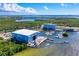 Aerial view of the community marina, boat storage, waterfront hotel, and scenic waterways at 315 Sapphire Lake Dr # 202, Bradenton, FL 34209