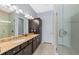 Bathroom with granite countertops, double sinks and walk in shower at 315 Sapphire Lake Dr # 202, Bradenton, FL 34209