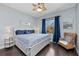 Bedroom with decorative bed coverings, ceiling fan and hardwood floors at 315 Sapphire Lake Dr # 202, Bradenton, FL 34209