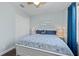 Cozy bedroom featuring a ceiling fan, white furniture and blue accents at 315 Sapphire Lake Dr # 202, Bradenton, FL 34209